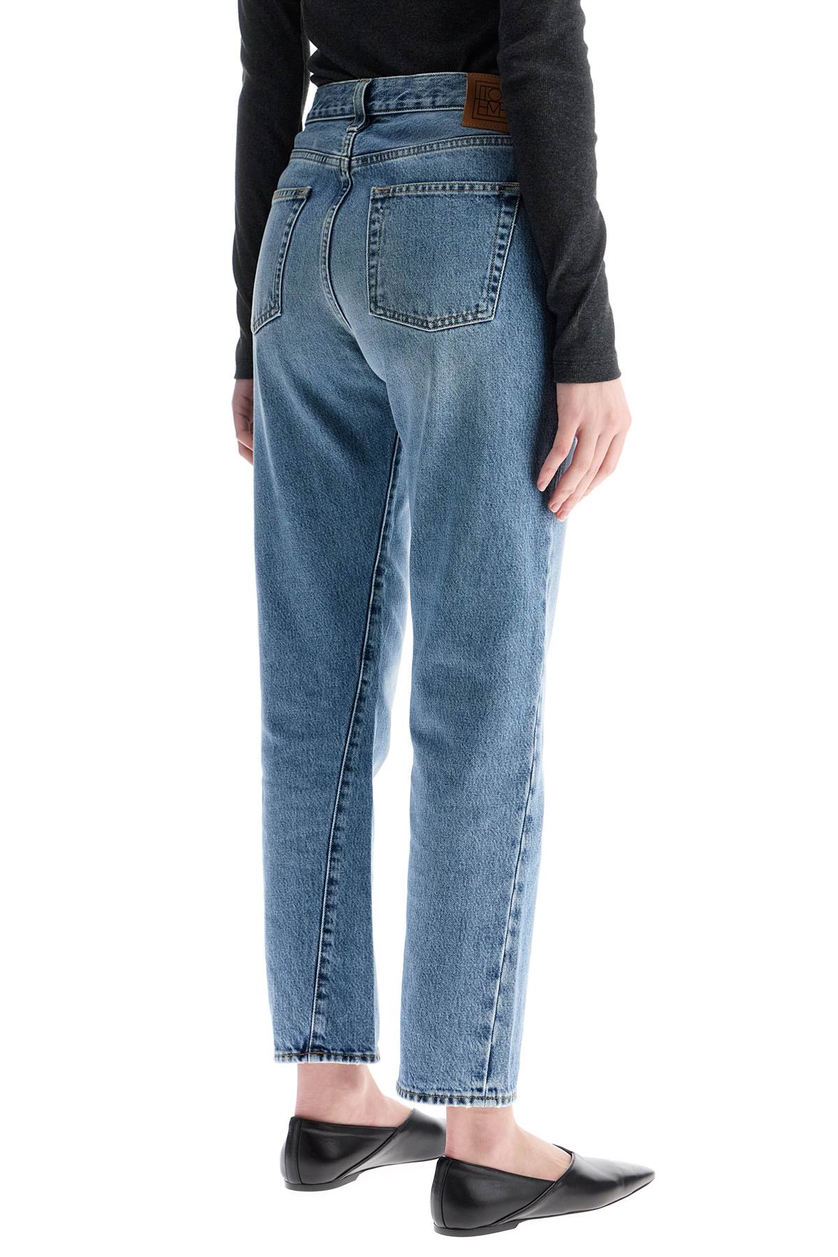 Toteme worn blue organic cotton jeans with twisted seams