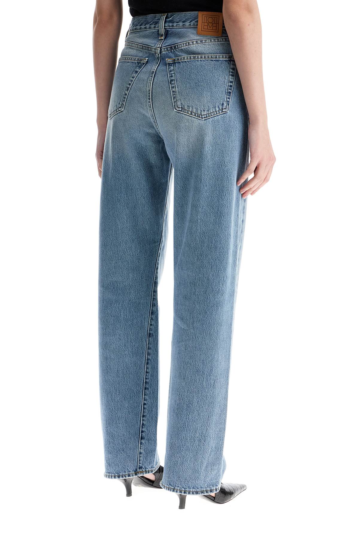 Toteme wide leg organic cotton jeans in worn blue with twisted seams - VivaceVenus